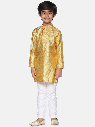 https://cdn.shopify.com/s/files/1/1857/6931/products/35b1e5e6-e0fa-45c5-95d0-fc3ac5f8a5f71639987743876SethukrishnaBoysGold-TonedPrintedKurtawithPyjamas1.jpg?v=1661584766